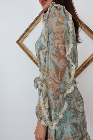 Zimmermann blue paisley floral silk playsuit with ruffle details lace trim and waist tie.