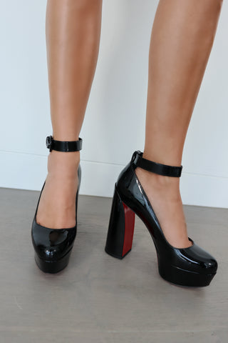 Christian Louboutin Movida black patent leather platform pumps with ankle strap and red sole