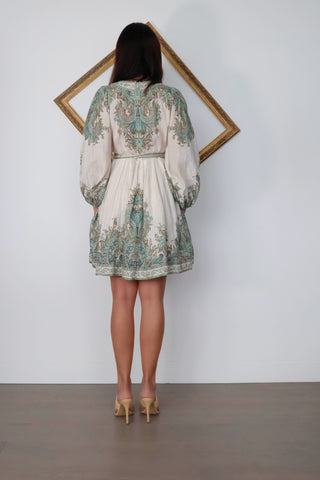 Zimmermann Brighton Paisley Mini Dress in turquoise paisley print with fabric-covered buttons, long blouson sleeves, self-tie waist belt, and linen fabrication.