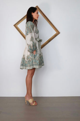 Zimmermann Brighton Paisley Mini Dress in turquoise paisley print with fabric-covered buttons, long blouson sleeves, self-tie waist belt, and linen fabrication.