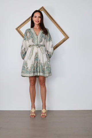 Zimmermann Brighton Paisley Mini Dress in turquoise paisley print with fabric-covered buttons, long blouson sleeves, self-tie waist belt, and linen fabrication.