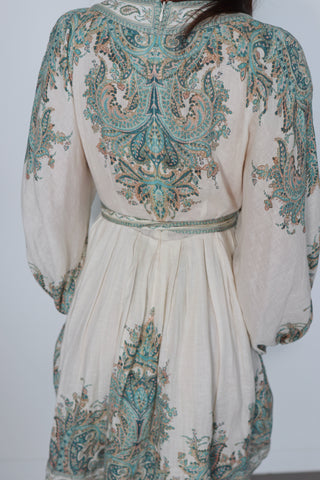 Zimmermann Brighton Paisley Mini Dress in turquoise paisley print with fabric-covered buttons, long blouson sleeves, self-tie waist belt, and linen fabrication.