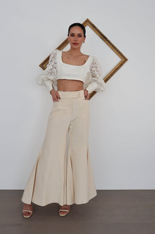 Zimmermann Kaleidoscope beige flared designer pants in size 0, high-waisted with pockets, shown styled on model.