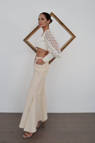 Zimmermann Kaleidoscope beige flared designer pants in size 0, high-waisted with pockets, shown styled on model.