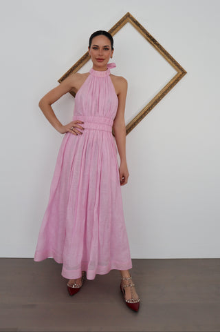 Zimmermann pink halter-neck midi dress with flowing skirt, shown on model.
