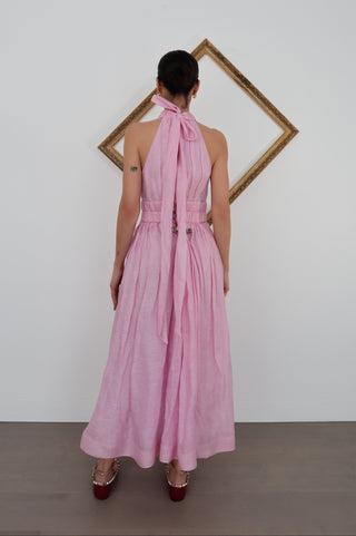 Zimmermann pink halter-neck midi dress with flowing skirt, shown on model.