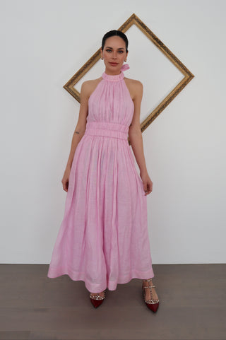 Zimmermann pink halter-neck midi dress with flowing skirt, shown on model.