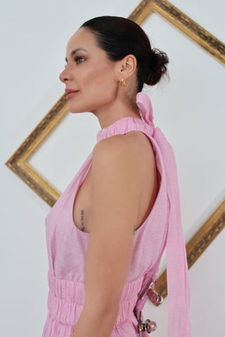 Zimmermann pink halter-neck midi dress with flowing skirt, shown on model.