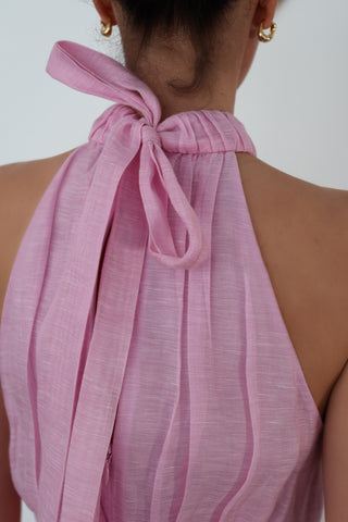 Zimmermann pink halter-neck midi dress with flowing skirt, shown on model.