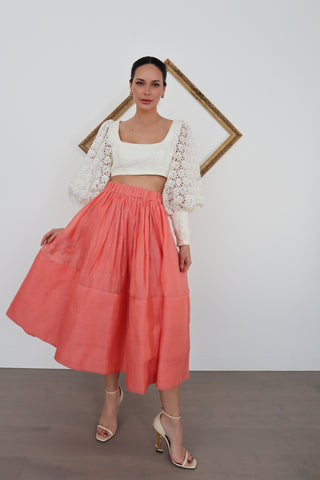 Zimmermann pink linen midi skirt in size 0 shown on model