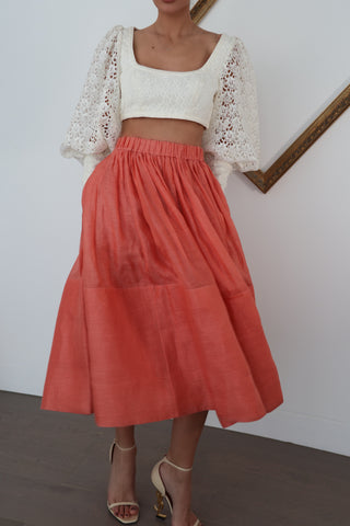 Zimmermann pink linen midi skirt in size 0 shown on model