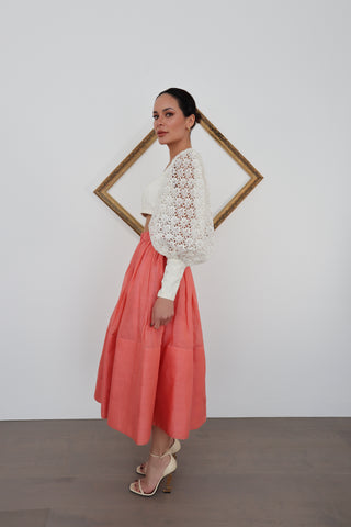 Zimmermann pink linen midi skirt in size 0 shown on model