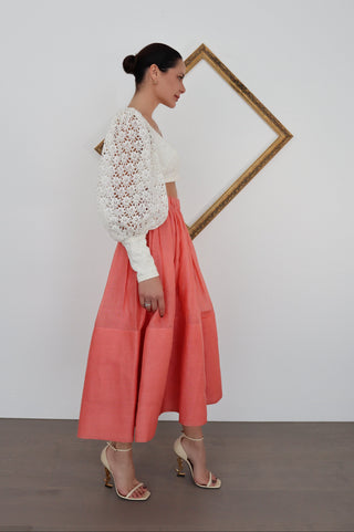 Zimmermann pink linen midi skirt in size 0 shown on model