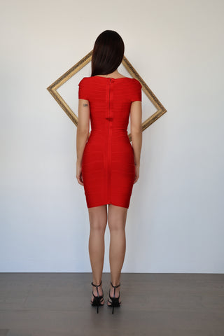 Hervé Léger Premiere red bandage mini dress featuring a sweetheart neckline, cap sleeves, fitted bodycon silhouette and signature figure-sculpting stretch construction.