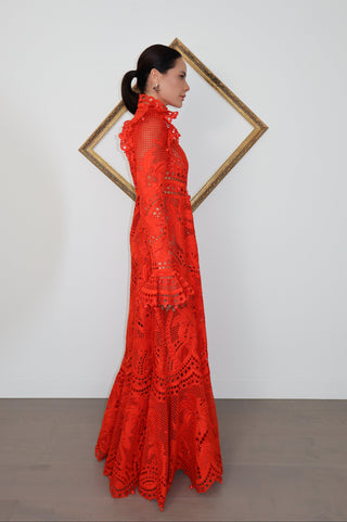Brightside Palm red openwork-lace silk organza gown with high neck and dramatic sleeves, shown on model.