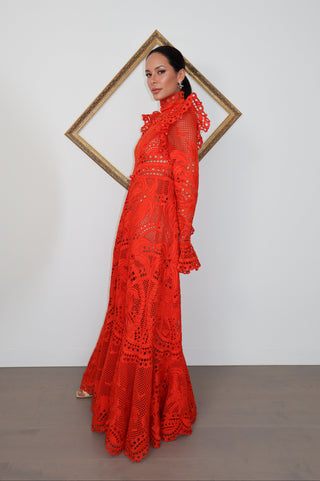 Brightside Palm red openwork-lace silk organza gown with high neck and dramatic sleeves, shown on model.
