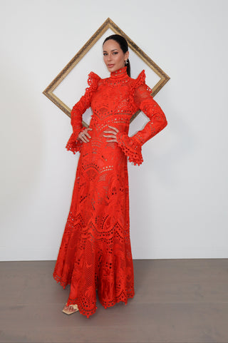 Brightside Palm red openwork-lace silk organza gown with high neck and dramatic sleeves, shown on model.
