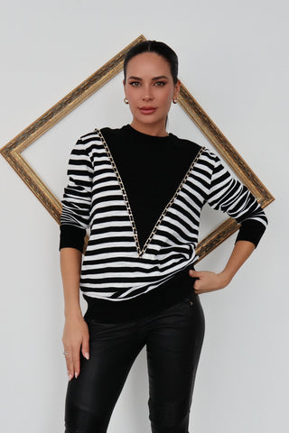 Balmain black and white striped pullover with chain detail.