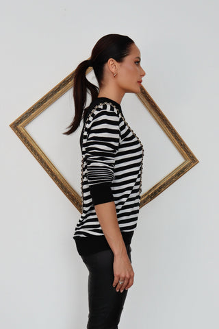 Balmain black and white striped pullover with chain detail.