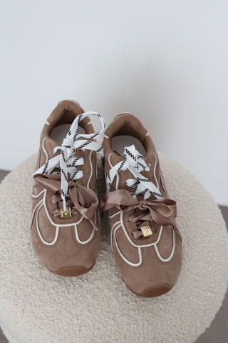 Naked Wolfe Adored sneakers in Mushroom suede, EU Size 40, featuring white contrast piping, oversized satin bow laces, logo-patterned laces, gold-tone hardware and chunky gum platform soles.
