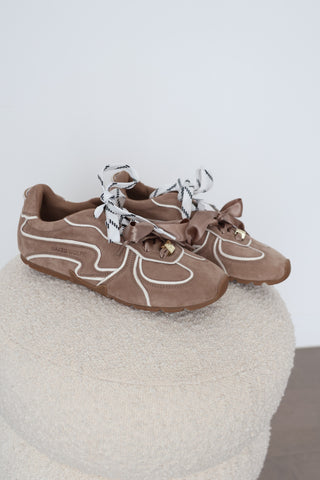 Naked Wolfe Adored sneakers in Mushroom suede, EU Size 40, featuring white contrast piping, oversized satin bow laces, logo-patterned laces, gold-tone hardware and chunky gum platform soles.