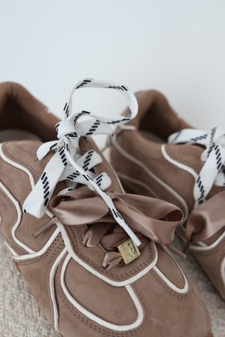 Naked Wolfe Adored sneakers in Mushroom suede, EU Size 40, featuring white contrast piping, oversized satin bow laces, logo-patterned laces, gold-tone hardware and chunky gum platform soles.
